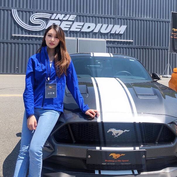 Eunchae Ko poses next to a Mustang GT Eunchae Ko poses next to a Mustang GT